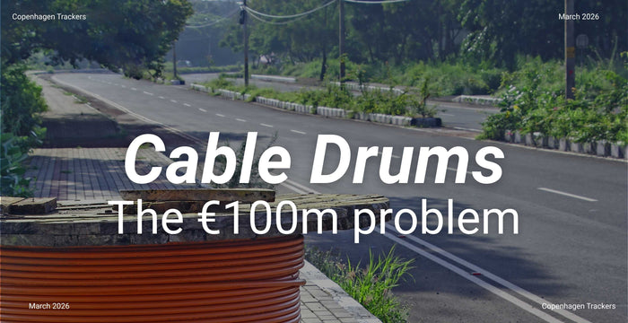 Road with cable drums and text overlay 'Cable Drums The €100m problem' on a blue filter.
