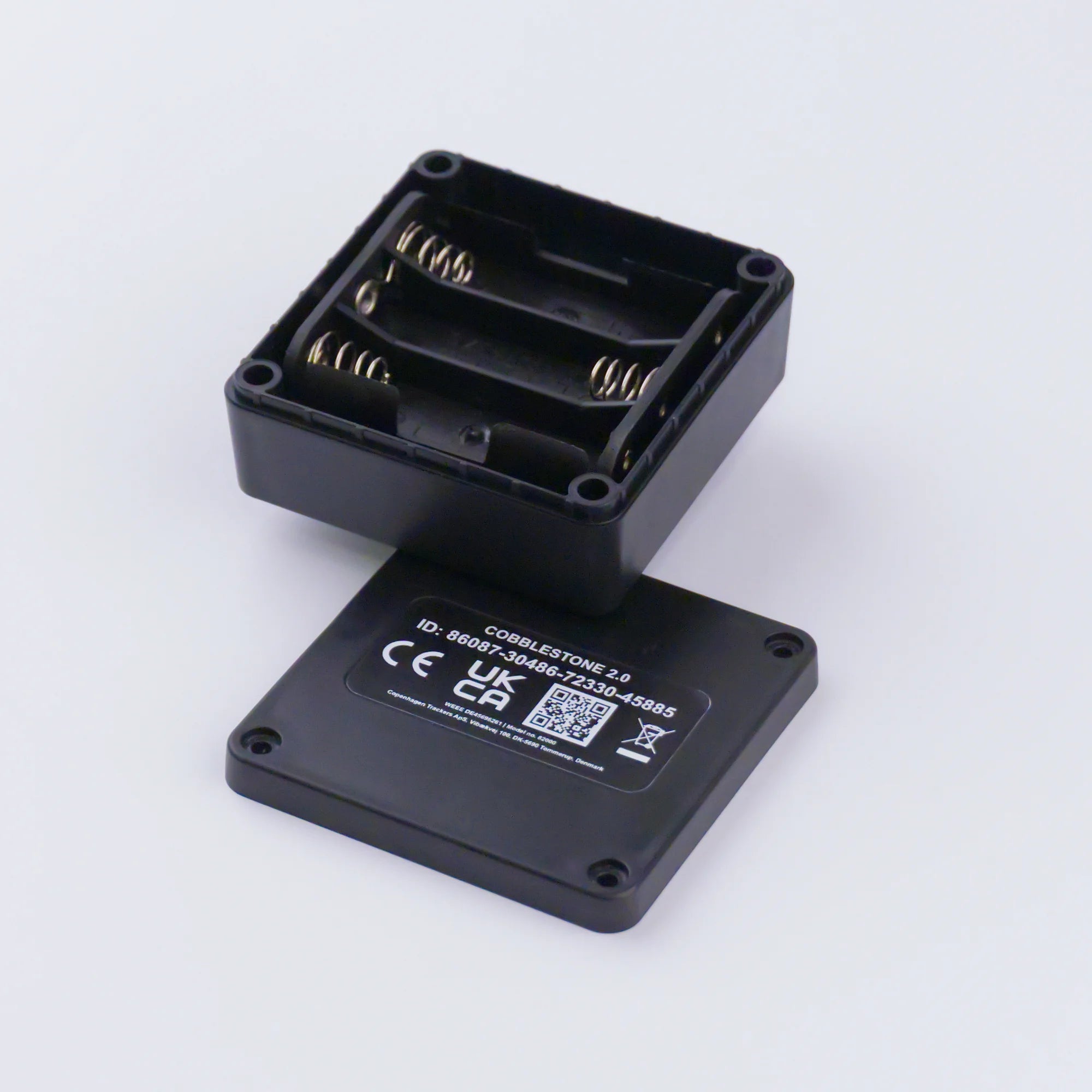 Open back side of the Cobblestone 2.0 GPS tracker, slots for 3 x AA batteries