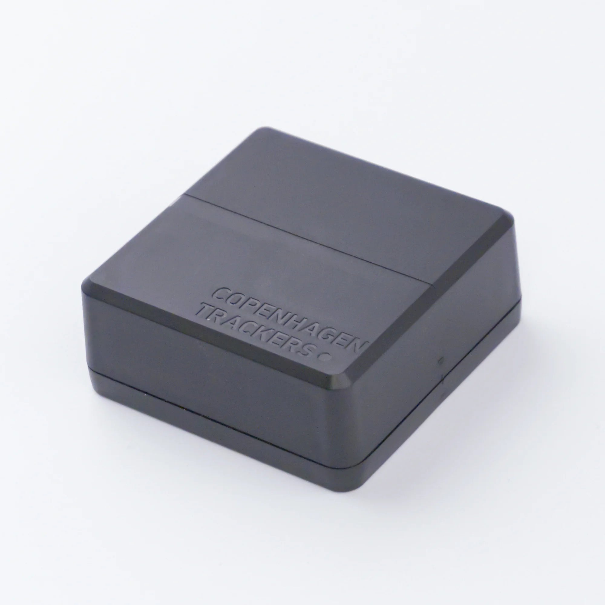 Cobblestone 2.0 GPS tracker with 'Copenhagen Trackers' branding on a white background